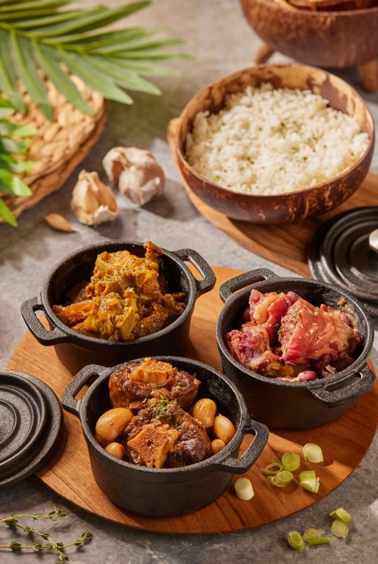 Traditional African meal with jollof rice, grilled chicken, and fried plantains, styled for a Toronto restaurant menu