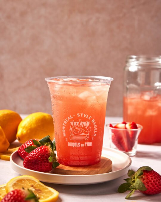 Strawberry Lemon juice water on the counter top arrange and style in beautiful commercial lighting