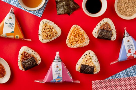 Onigiri sushi on vibrant colour with minimal styling and high-end food photography,professionally photographed.