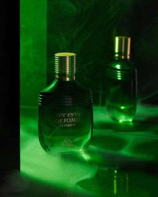 High-quality close-up shot of luxury perfume bottle on a mirror surface