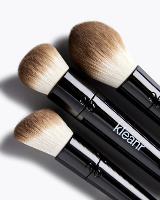 Product photography of beauty product photography of 3 kind of make up brushes washable Blending,Buffing, sculpting together being photograph from top bird eye view angle on the bright background