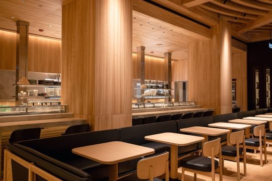 Ambiance of a high-end restaurant with soft lighting and plush seating in Toronto's dining district