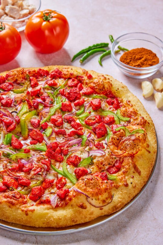 Pizza on table with minimal styling and high-end food photography,professionally photographed.