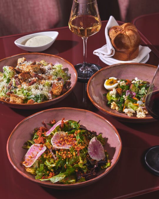 Food photography for Revery Hotel at Deauville club. Three main dish arrange on the table with glass of wine ligthing