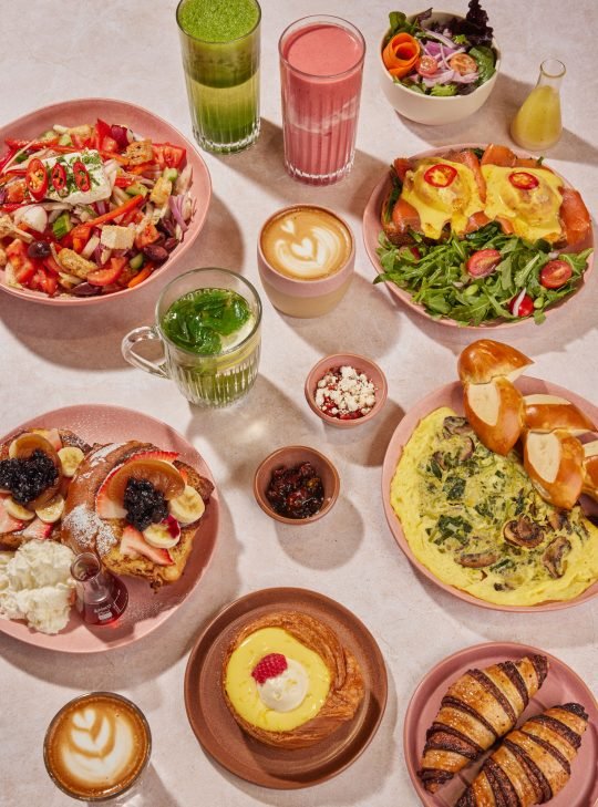 Bready Café’s seasonal menu featuring a range of baked goods, salads, and savory dishes, beautifully arranged on a marble board
